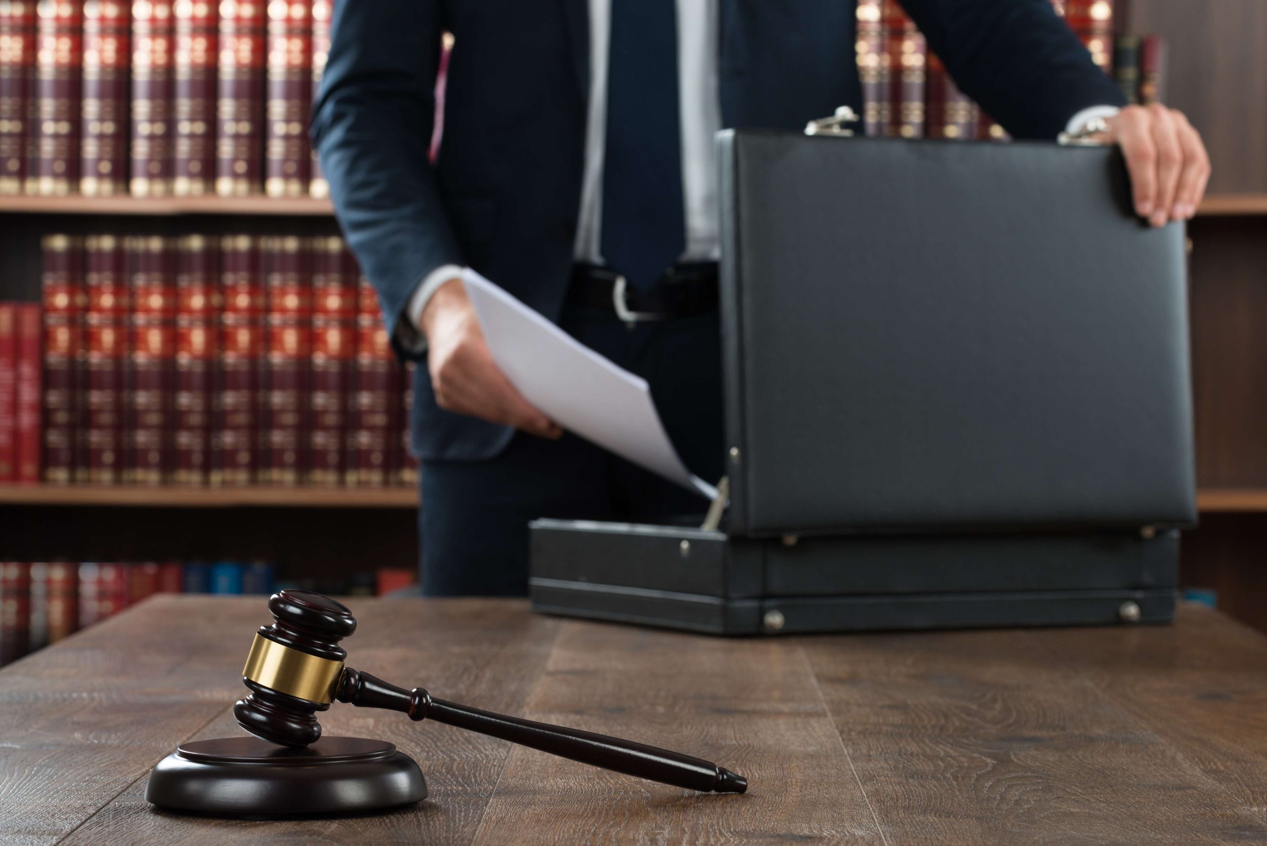 Lawyer Putting Documents In Briefcase