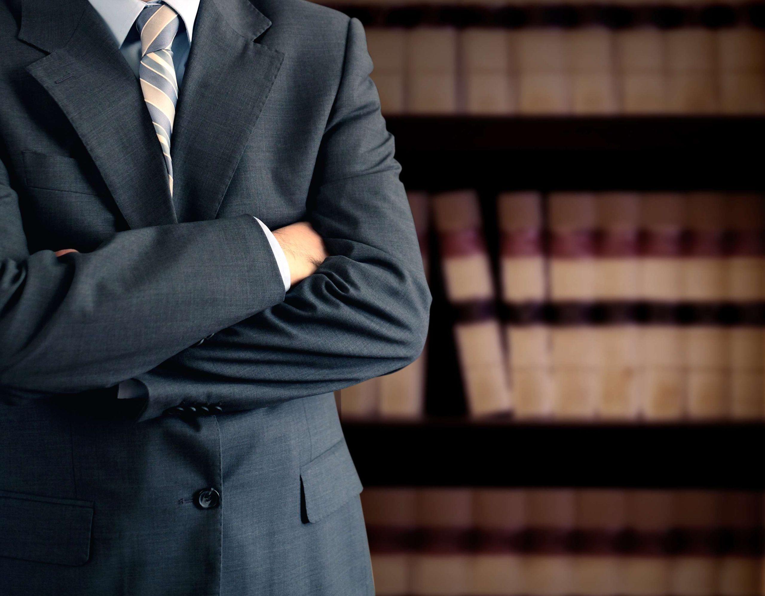 Businessman in front of bookcase