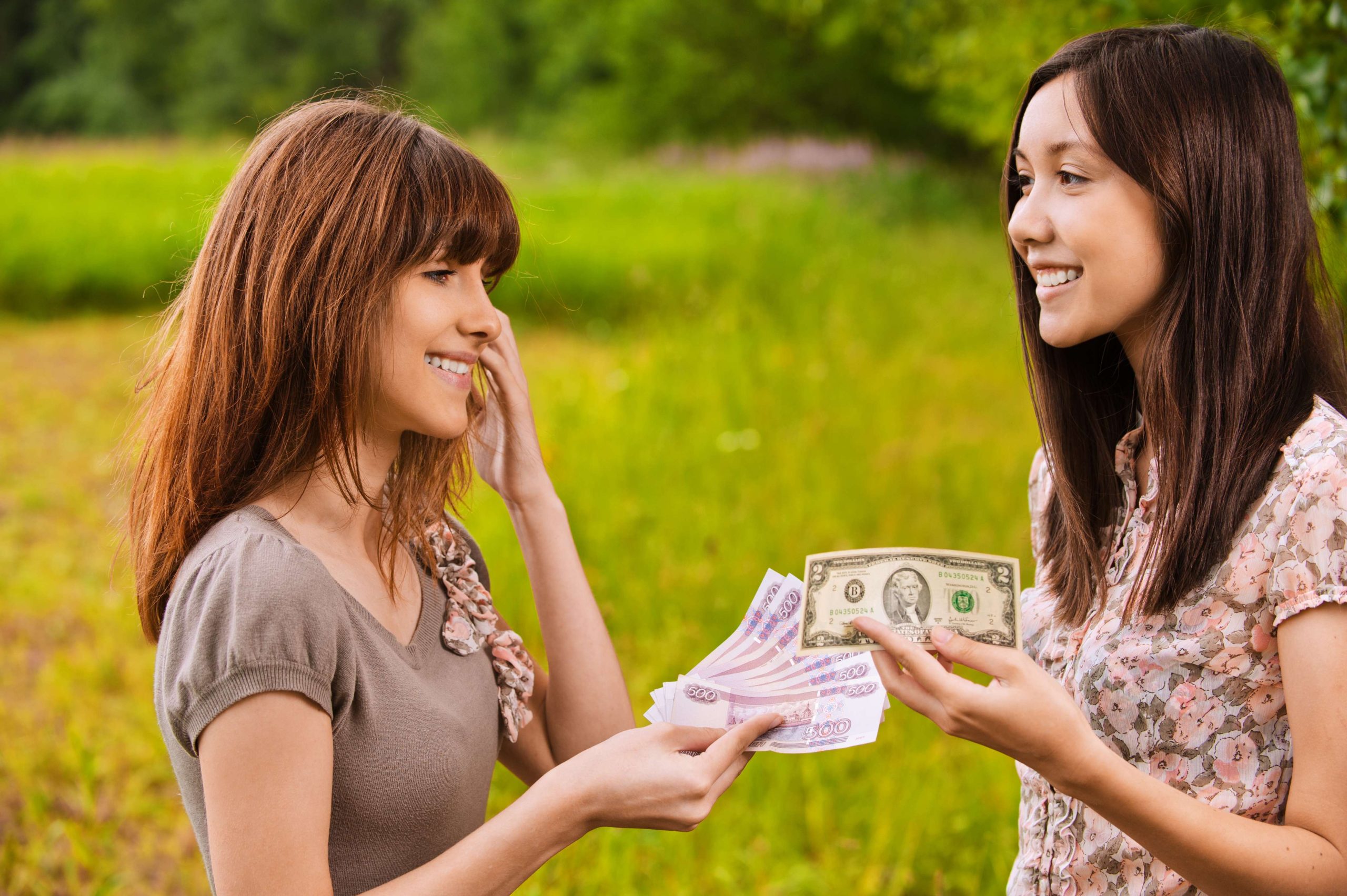 two young women concluding bargain